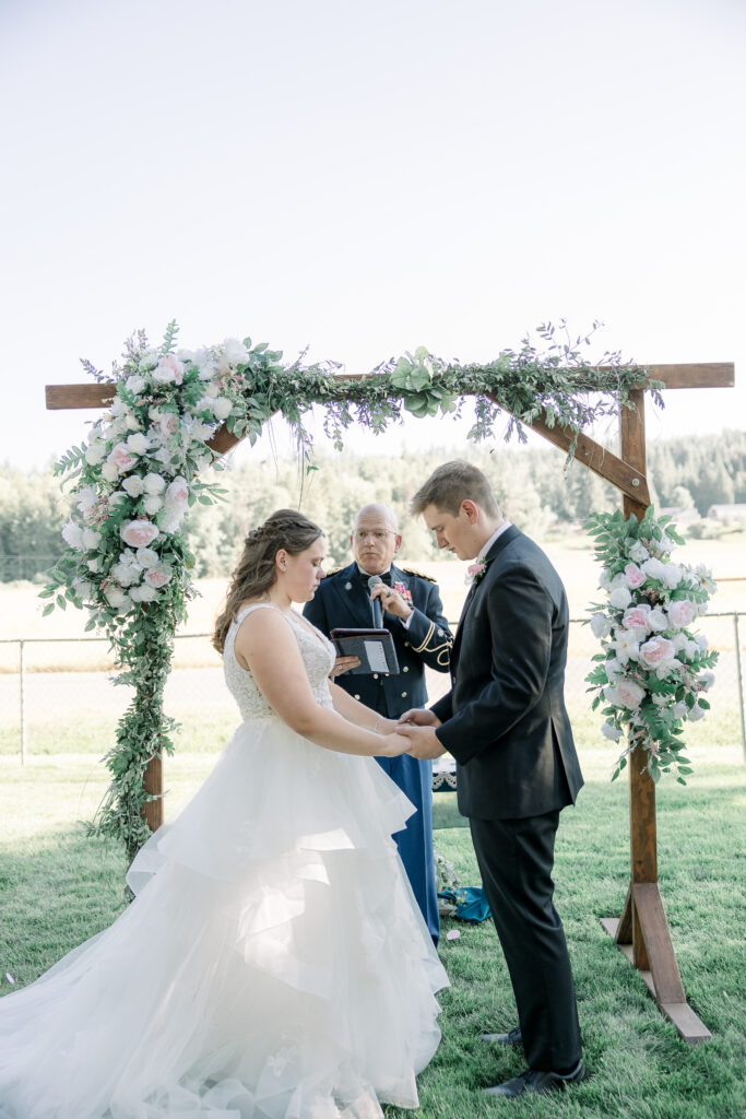 bride and groom standing at alter on their wedding day